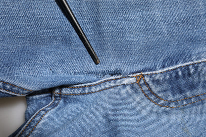 Dolce & Gabbana Blue Washed Tattered Logo Plaque Denim Jeans